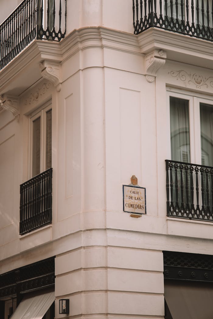 A classic architectural corner with ornate balconies in Valencia, Spain.